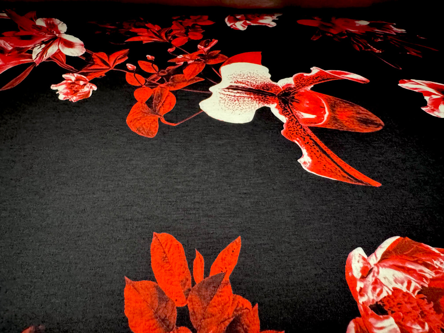 Soft handle jersey fabric, per metre - black with red orchid print