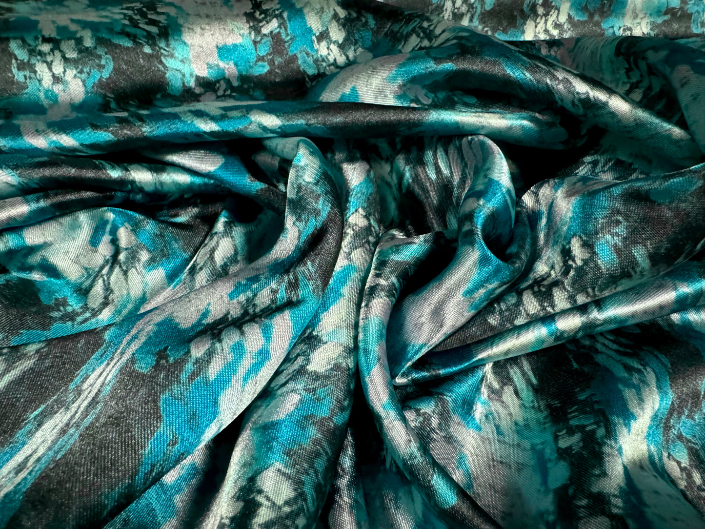 Silky satin woven dress fabric, per metre - distressed houndstooth print - turquoise & black