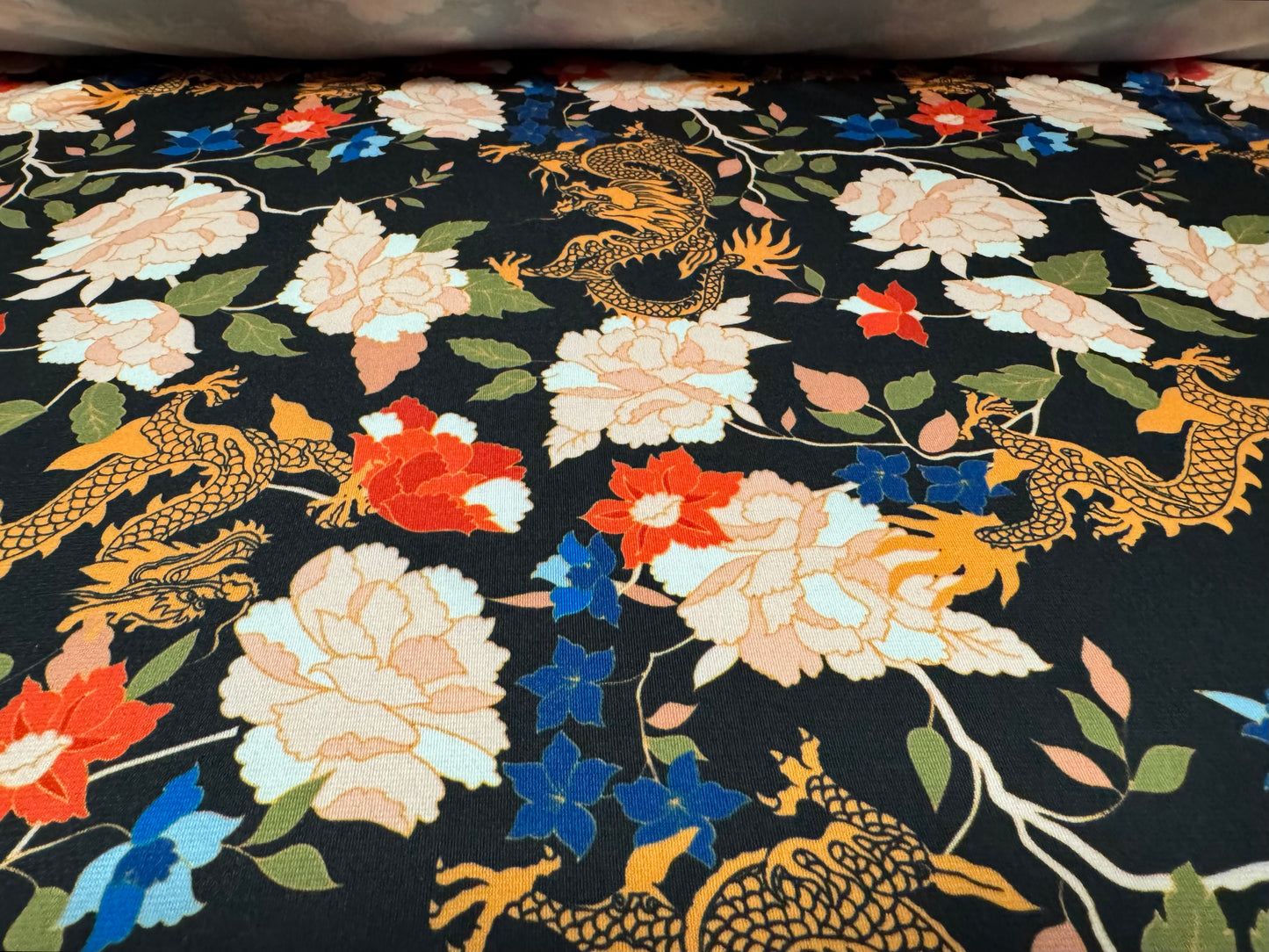 Soft touch stretch spandex single jersey fabric, per metre - dragons & flowers print - multicolour