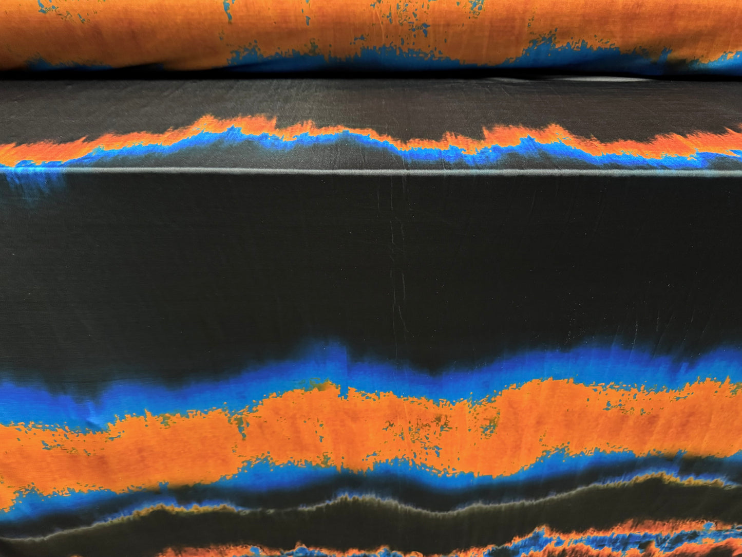 Disco stretch single jersey fabric, per metre - volcano ombré print - black blue & orange