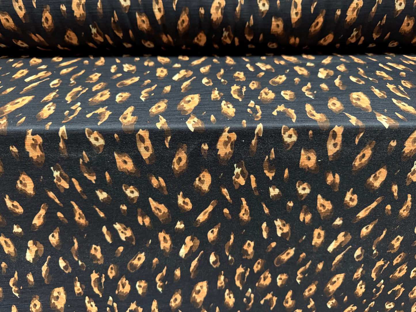 Single jersey fashion fabric with slub, per metre - animal print - black & peach