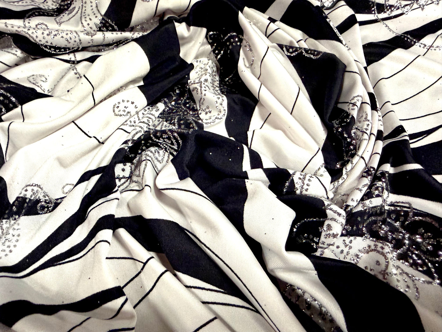 Metallic stretch single jersey fabric, per metre - wave print with paisley glitter- black ivory & silver