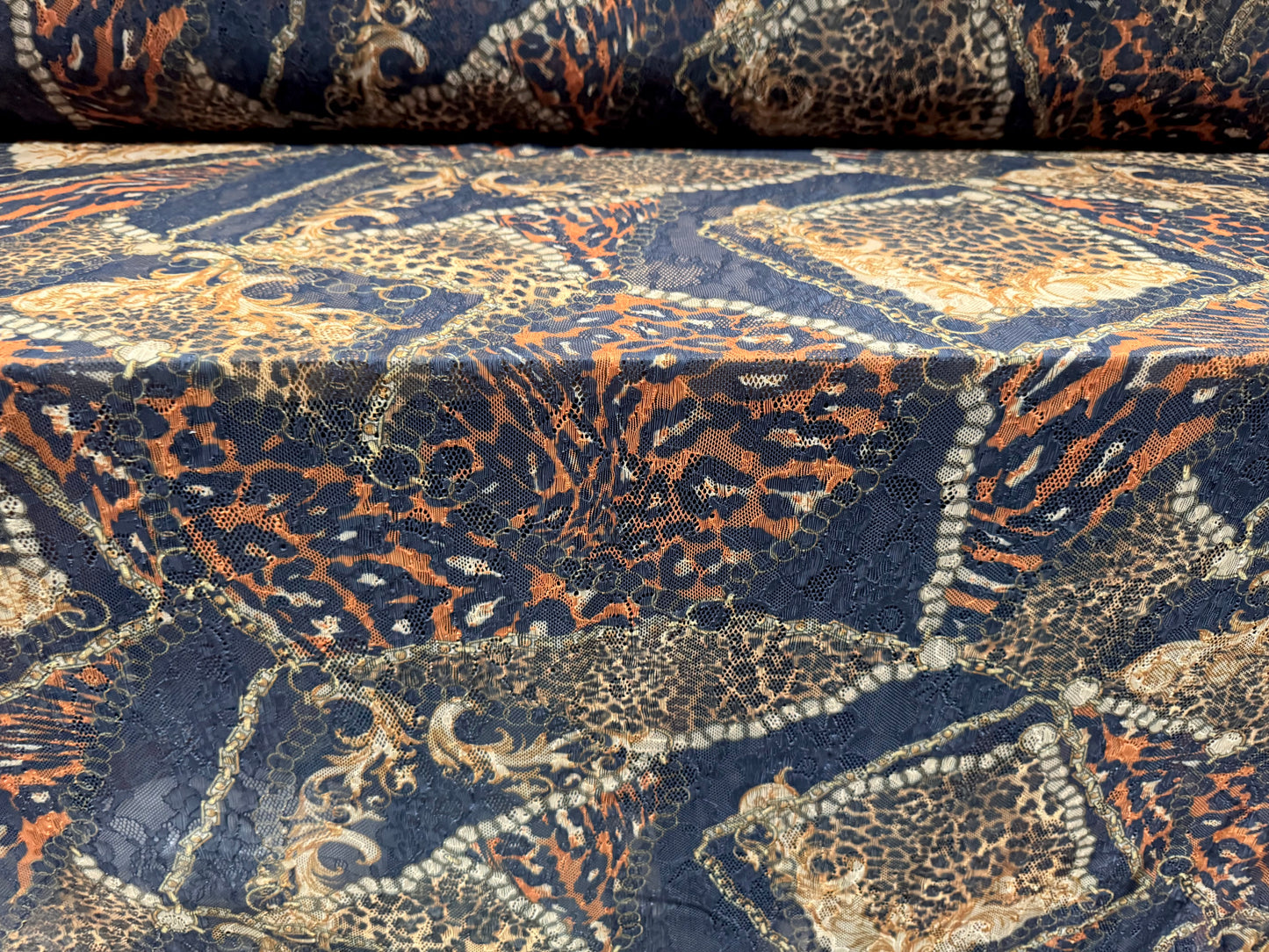 Stretch spandex lace fabric, per metre - leopard & chains print - black gold & orange