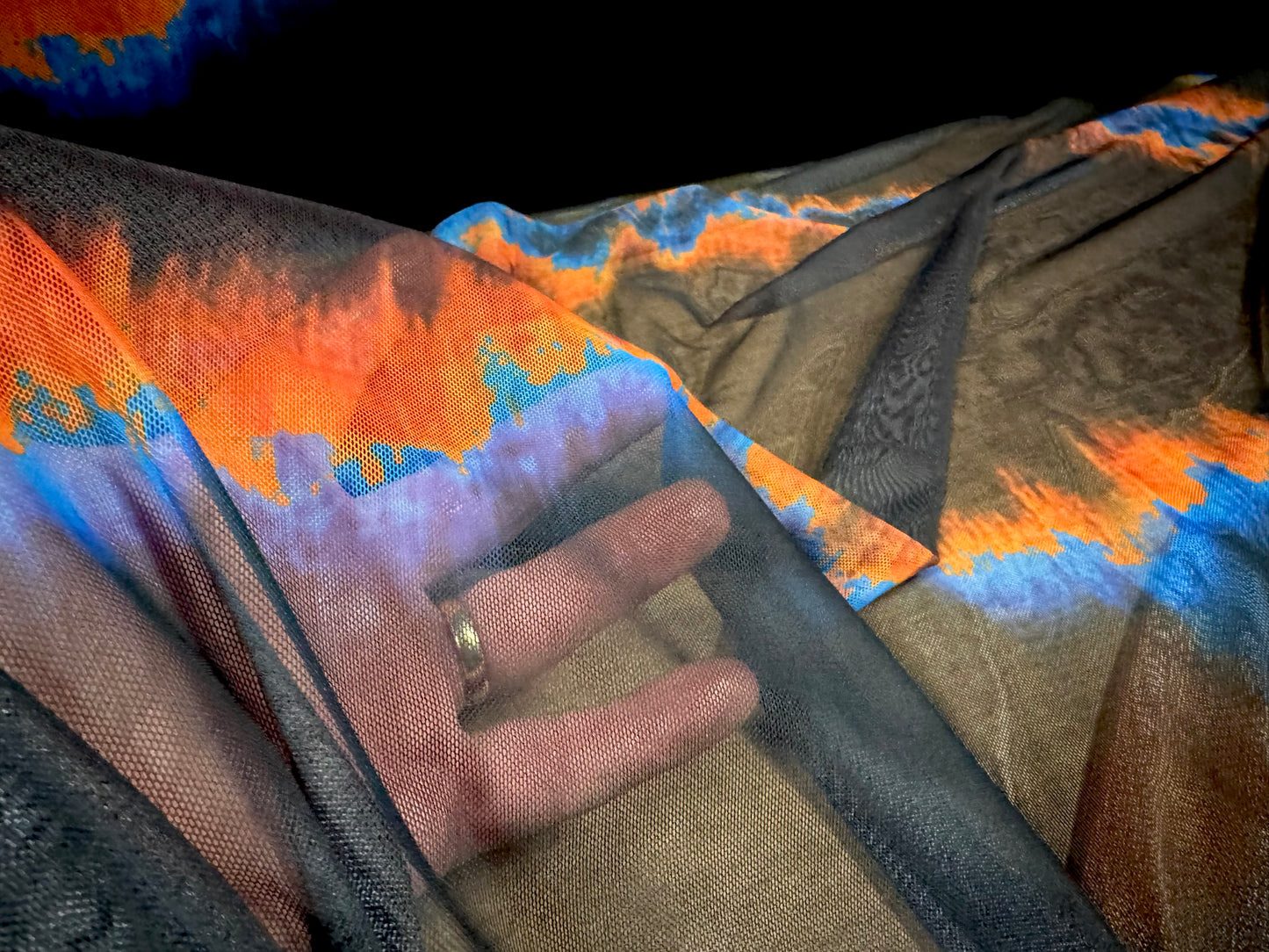 Power mesh net stretch spandex fabric, per metre - ombré volcano print - black orange & blue