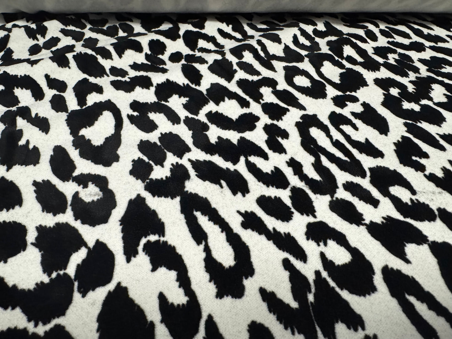 Stretch spandex double jersey fabric, per metre - flocked cheetah print - white & black