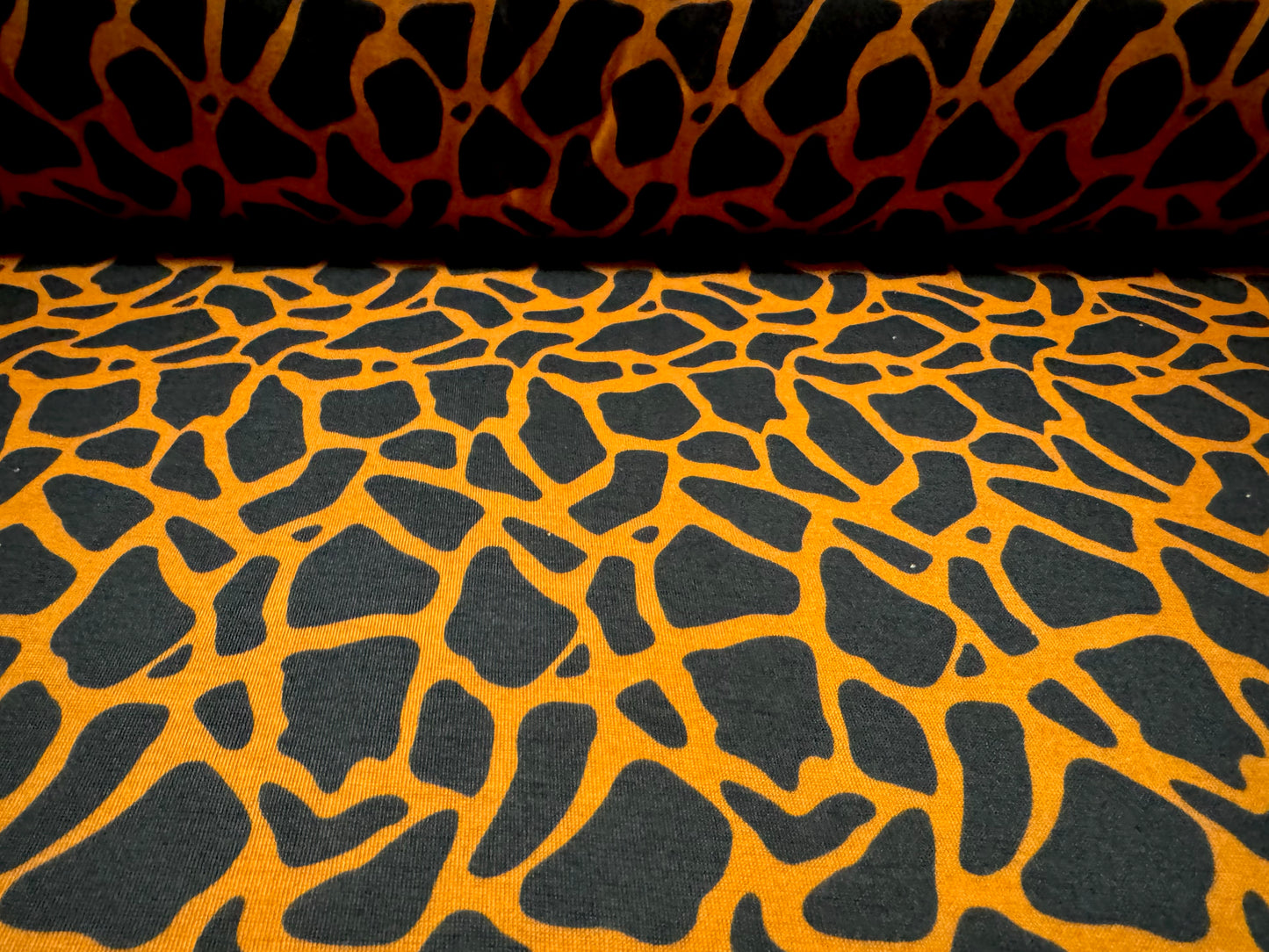 Soft handle single jersey fashion fabric, per metre - giraffe animal print - orange & black