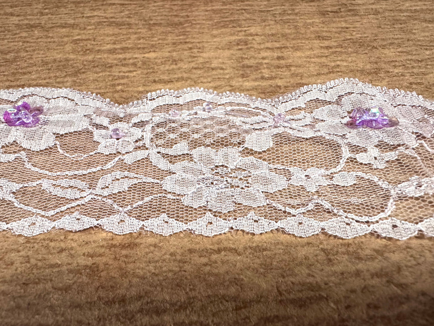 Scalloped lace edging trim fabric - floral - lilac with sequins