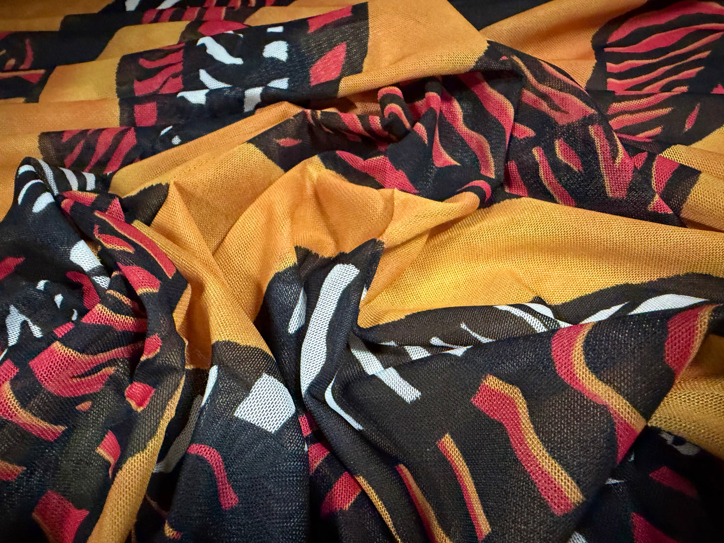 Power mesh net stretch spandex fabric, per metre - tribal print - amber