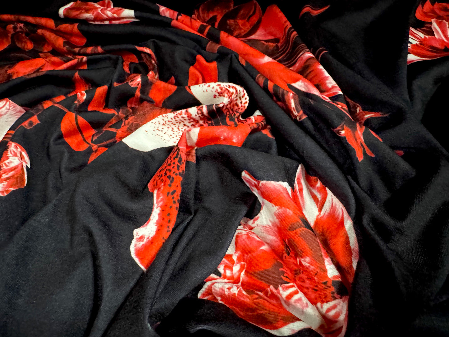 Soft handle jersey fabric, per metre - black with red orchid print