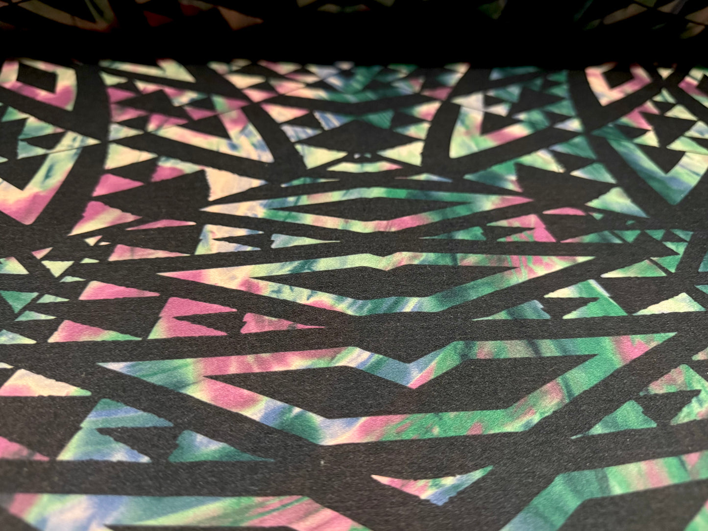Valentino scuba style stretch jersey fabric, per metre - geometric tribal swirl print - dark emerald green, black & pink