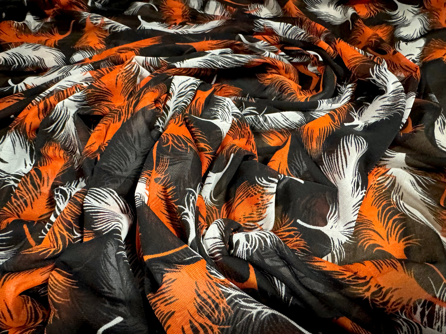 Chiffon jersey dress blouse fabric, per metre - feathers print - black & Orange