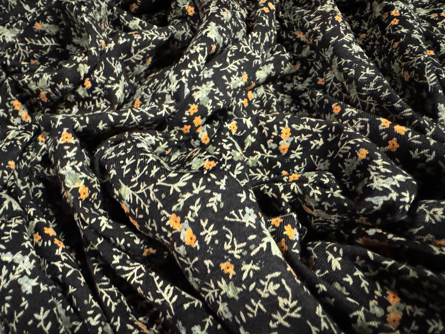Viscose spandex stretch single jersey fabric, per metre - small ditsy flower print - black sage & orange