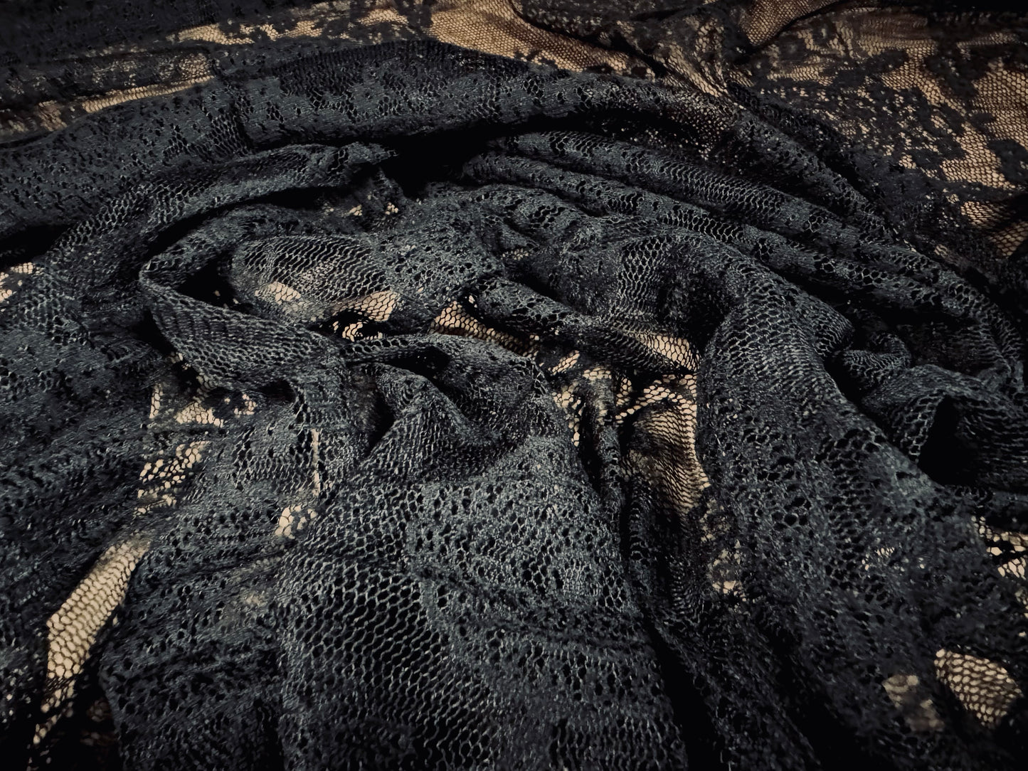 Lightweight flocked mesh fabric, per metre - stylised flower - black