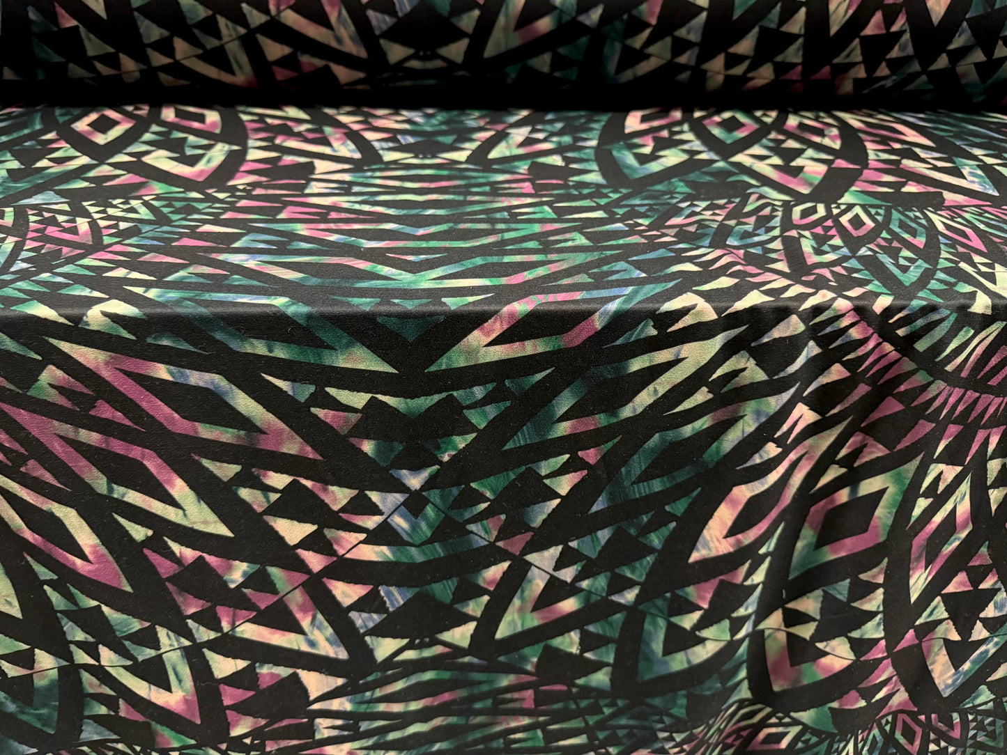Valentino scuba style stretch jersey fabric, per metre - geometric tribal swirl print - dark emerald green, black & pink