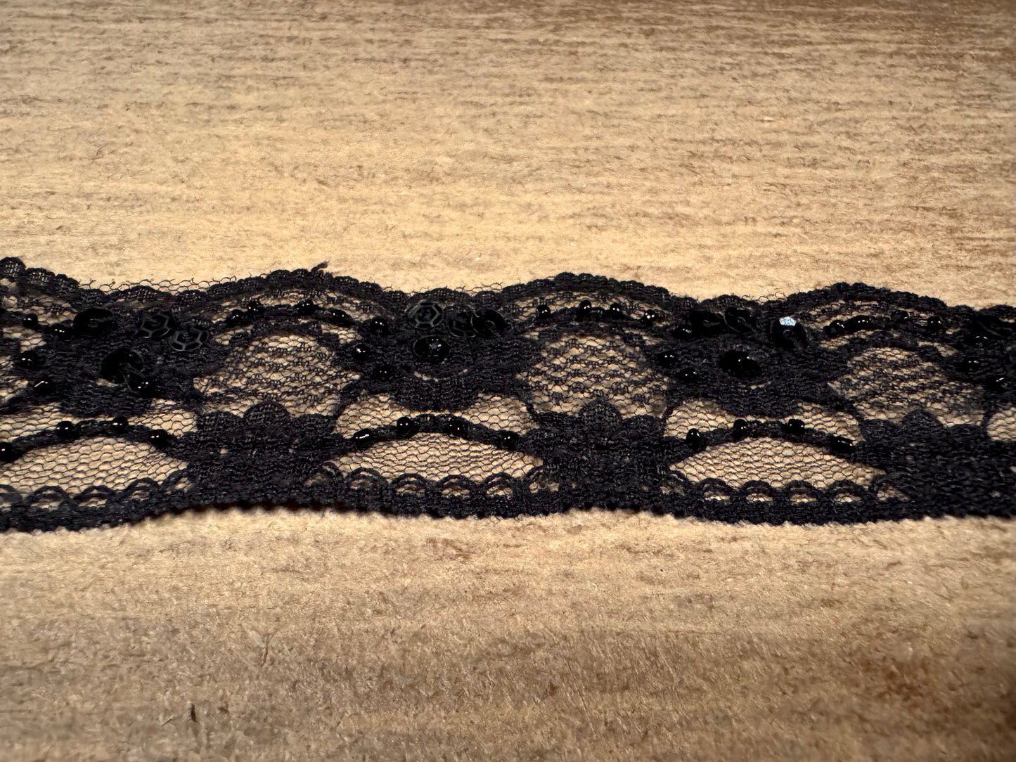 Scalloped lace edging trim fabric with sequins, per metre - floral - black