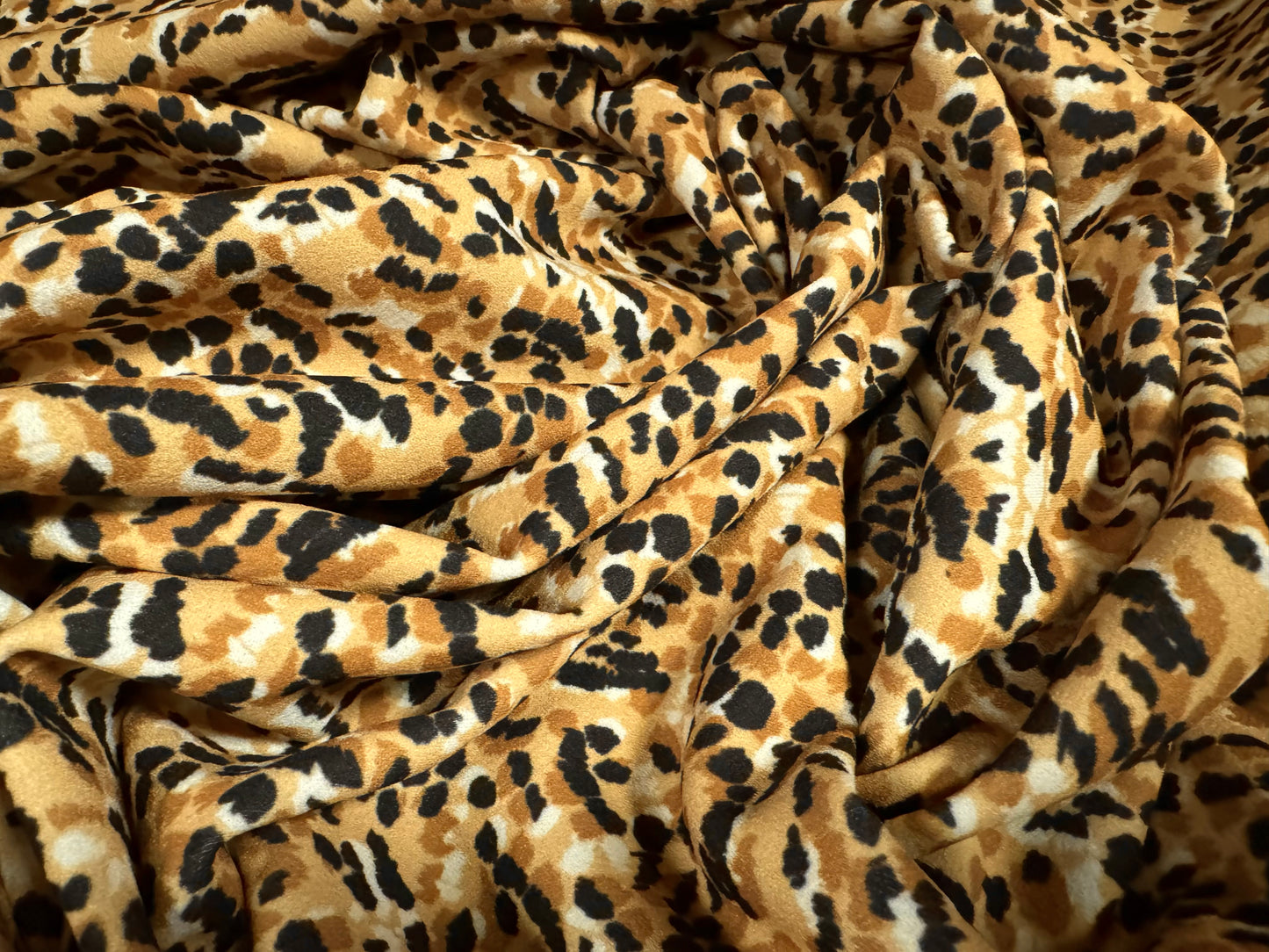 Scuba crepe stretch spandex jersey dress fabric, per metre - stylised animal print - honey & black