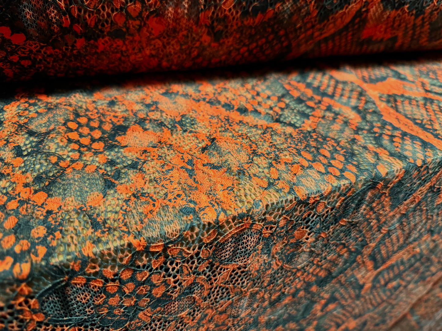Stretch lace dress fabric with scalloped selvedge, per metre - distressed snakeskin print - burnt orange