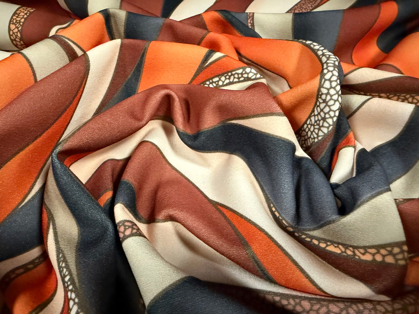 Scuba stretch spandex double jersey dress fabric, per metre - wavy swirl print - cream orange & rust