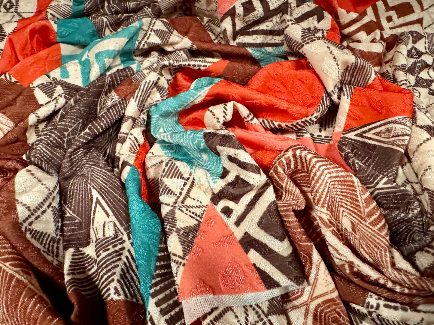 Stretch spandex jersey jacquard fabric, per metre - geometric swirl print - nude orange brown & turquoise