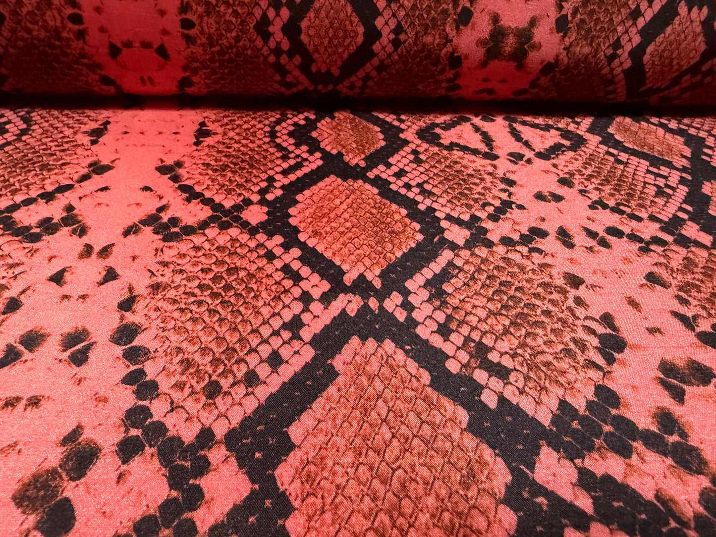 Shantung satin faux silk woven dress fabric, per metre - snakeskin print - coral