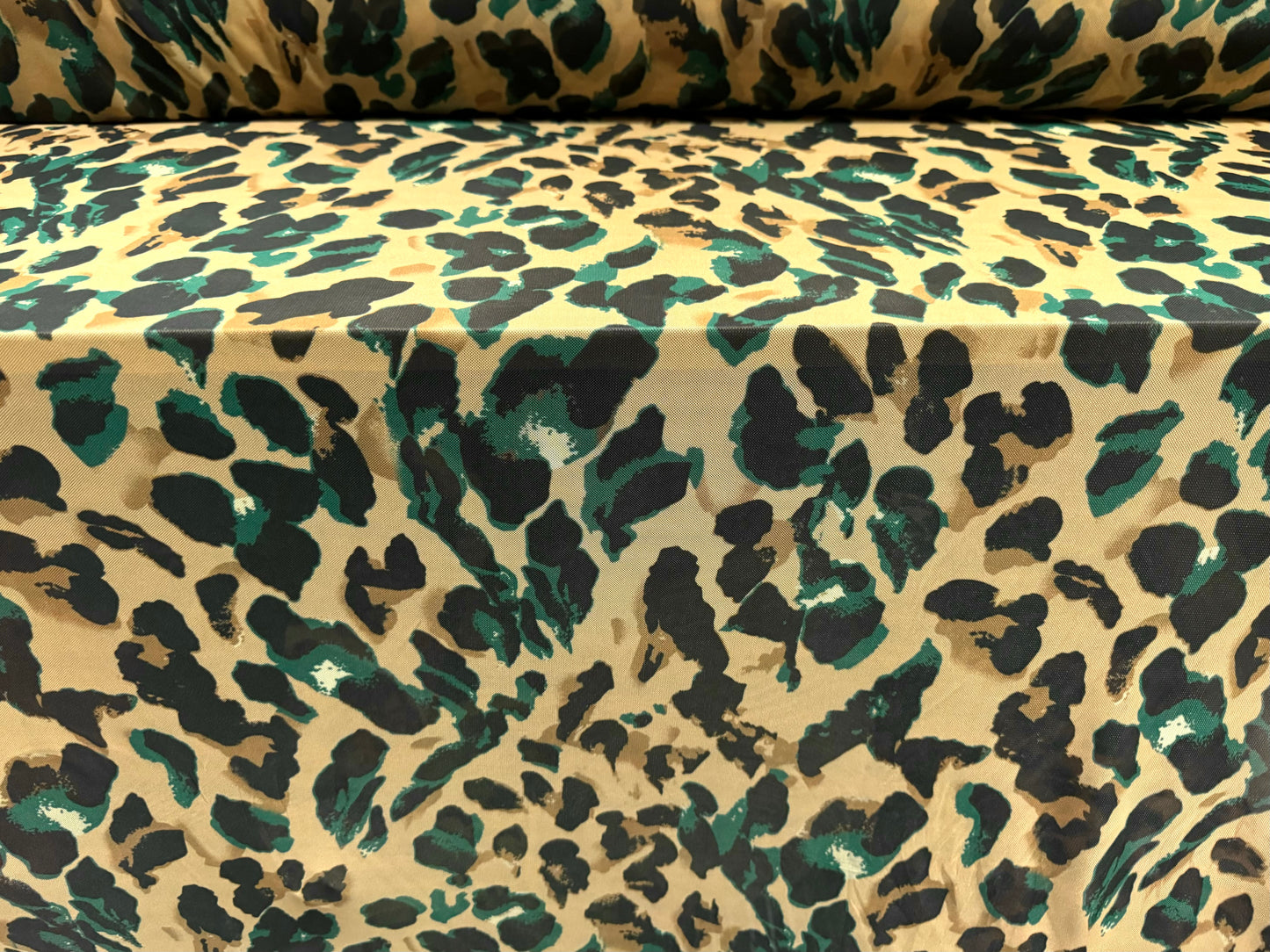 Power mesh net stretch spandex fabric, per metre - stylised animal print - beige & emerald green