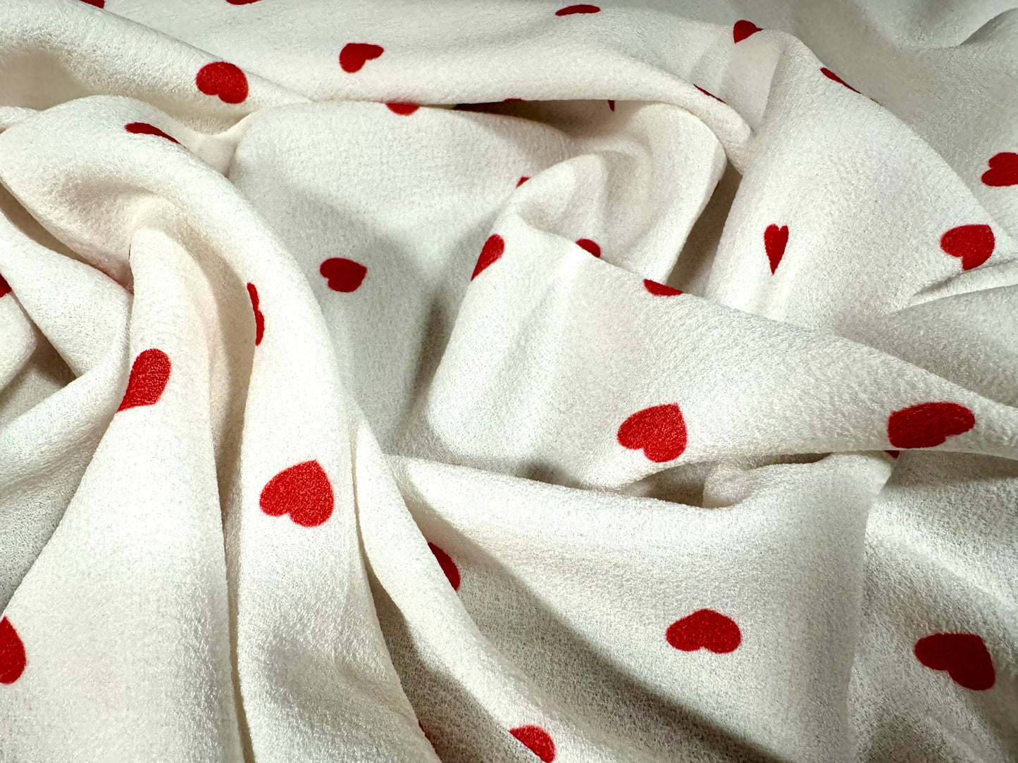 Bubble crepe woven dress fabric with comfort stretch, per metre - love heart print - ivory & red