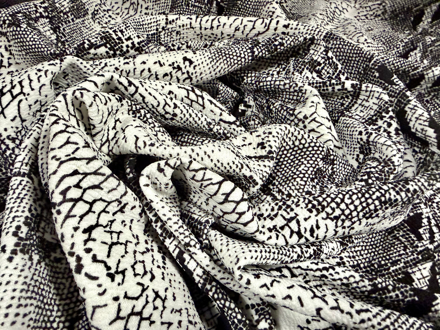 Waterfall textured scuba stretch double jersey fabric, per metre - snake skin print - black & ivory