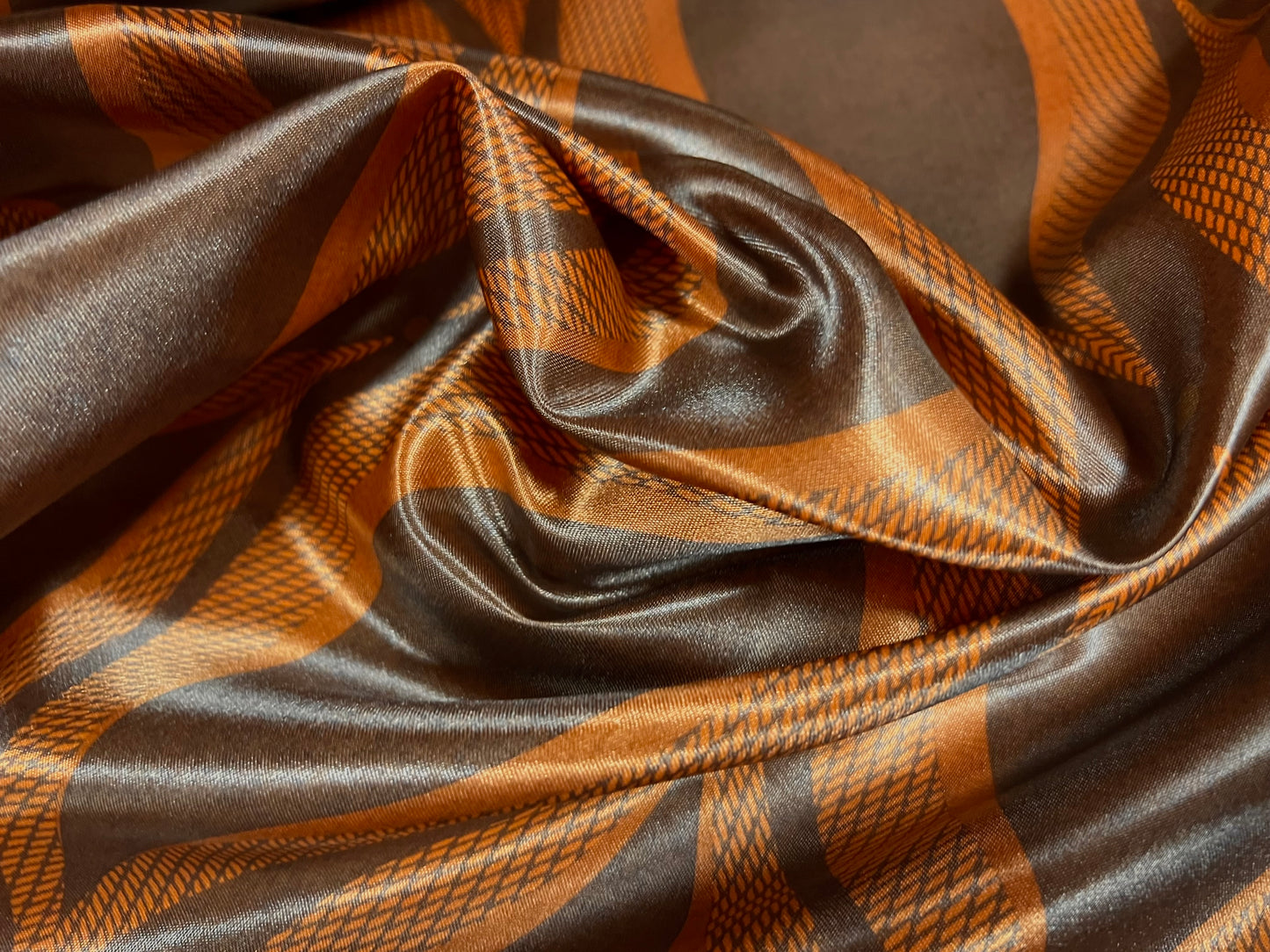 Silky Satin woven dress fabric, per metre - wave print - orange & copper