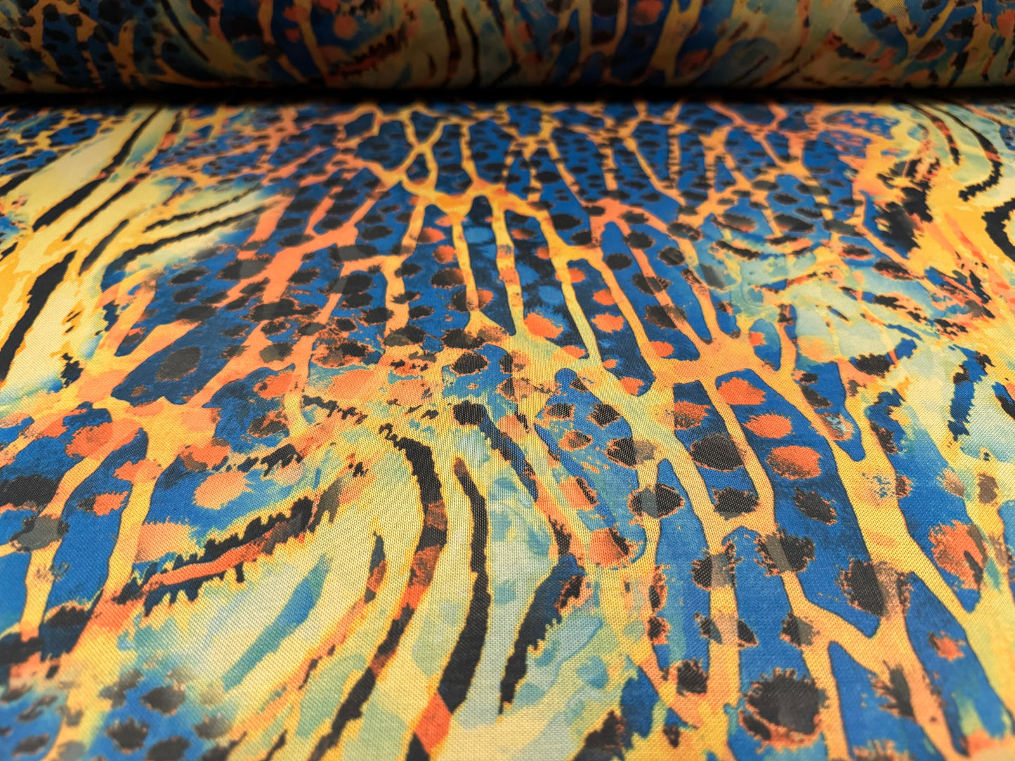 Power mesh net stretch spandex fabric, per metre - Crazy Tiger print - blue & amber