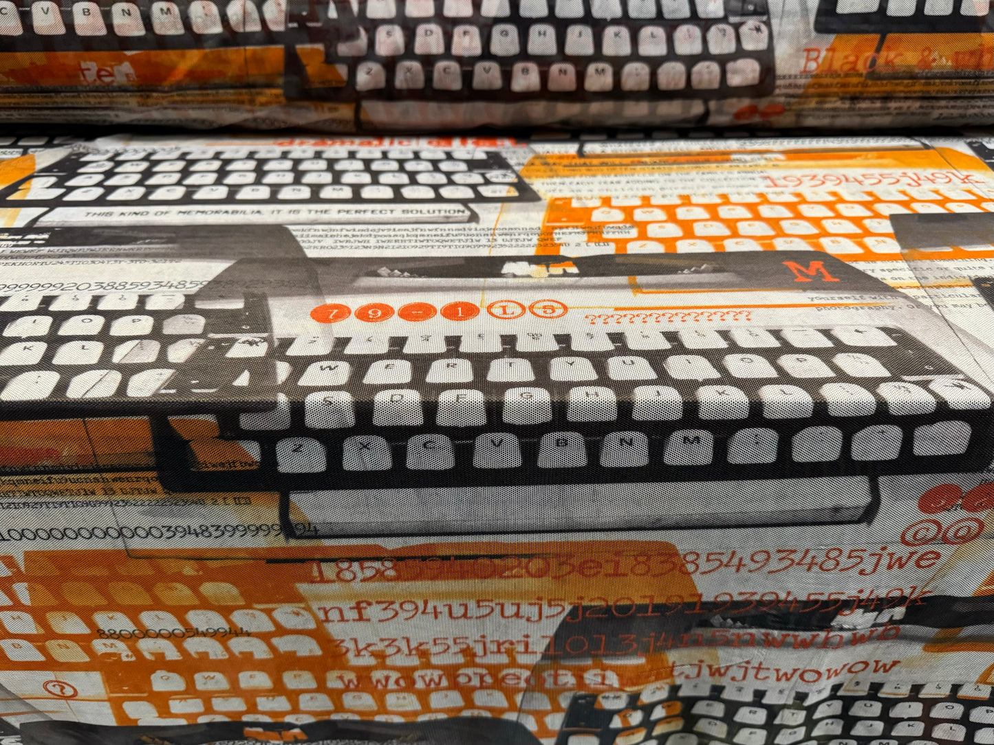 Power mesh net sheer stretch spandex fabric, per metre - retro typewriter print - Orange & charcoal