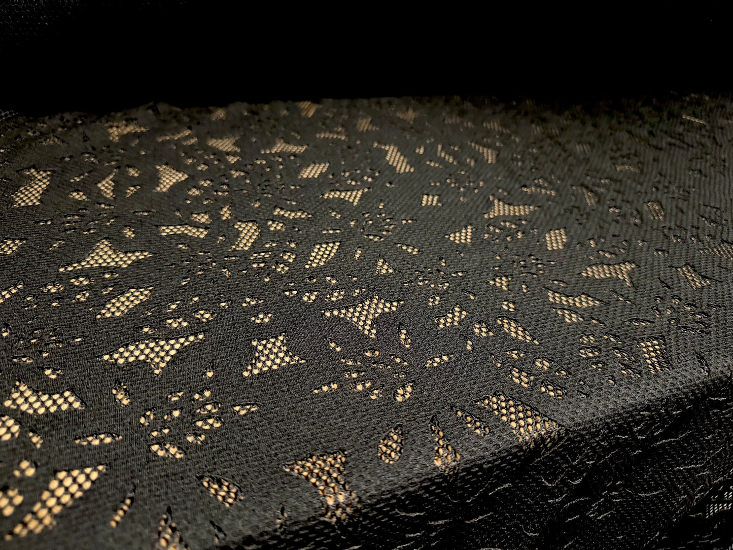 Fishnet scuba fabric with bonded floral appliqué, per metre - flower design - black