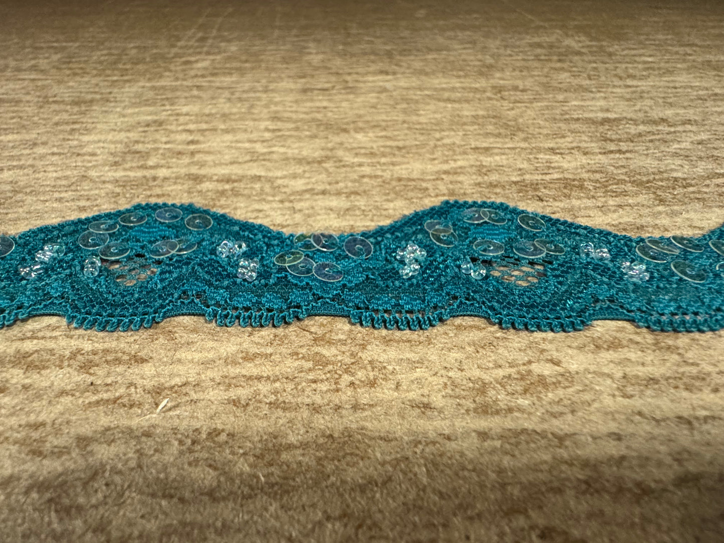Scalloped lace edging trim fabric with sequins - stretch - Skobeloff green