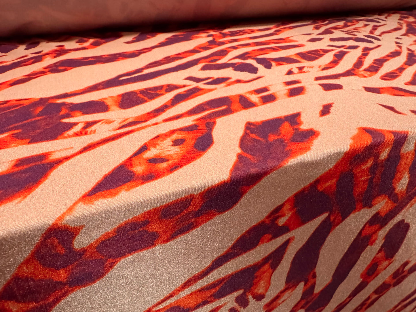 Yoga stretch spandex jersey fabric, per metre - stylised animal print - coral