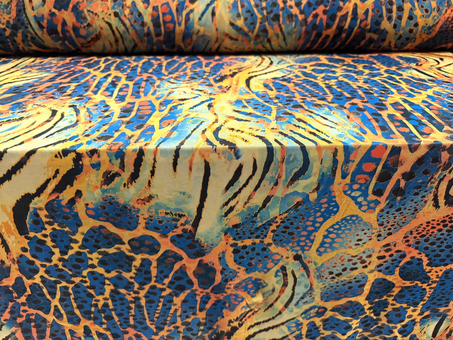 Power mesh net stretch spandex fabric, per metre - Crazy Tiger print - blue & amber