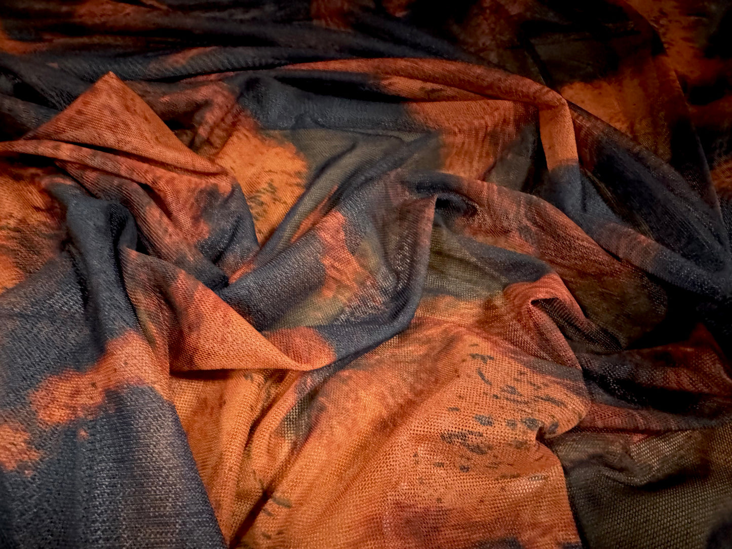 Power mesh net stretch spandex fabric, per metre - molten lava print - black & dark orange