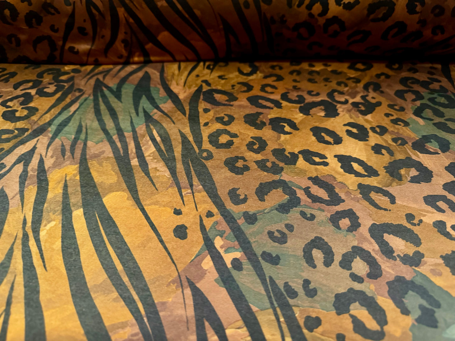 Soft touch stretch spandex single jersey fabric, per metre - stylised animal print - dark honey