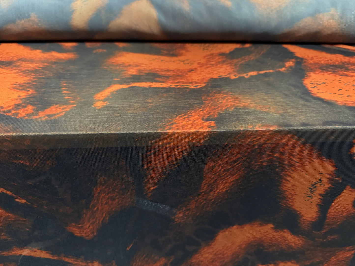 Power mesh net stretch spandex fabric, per metre - molten lava print - black & dark orange