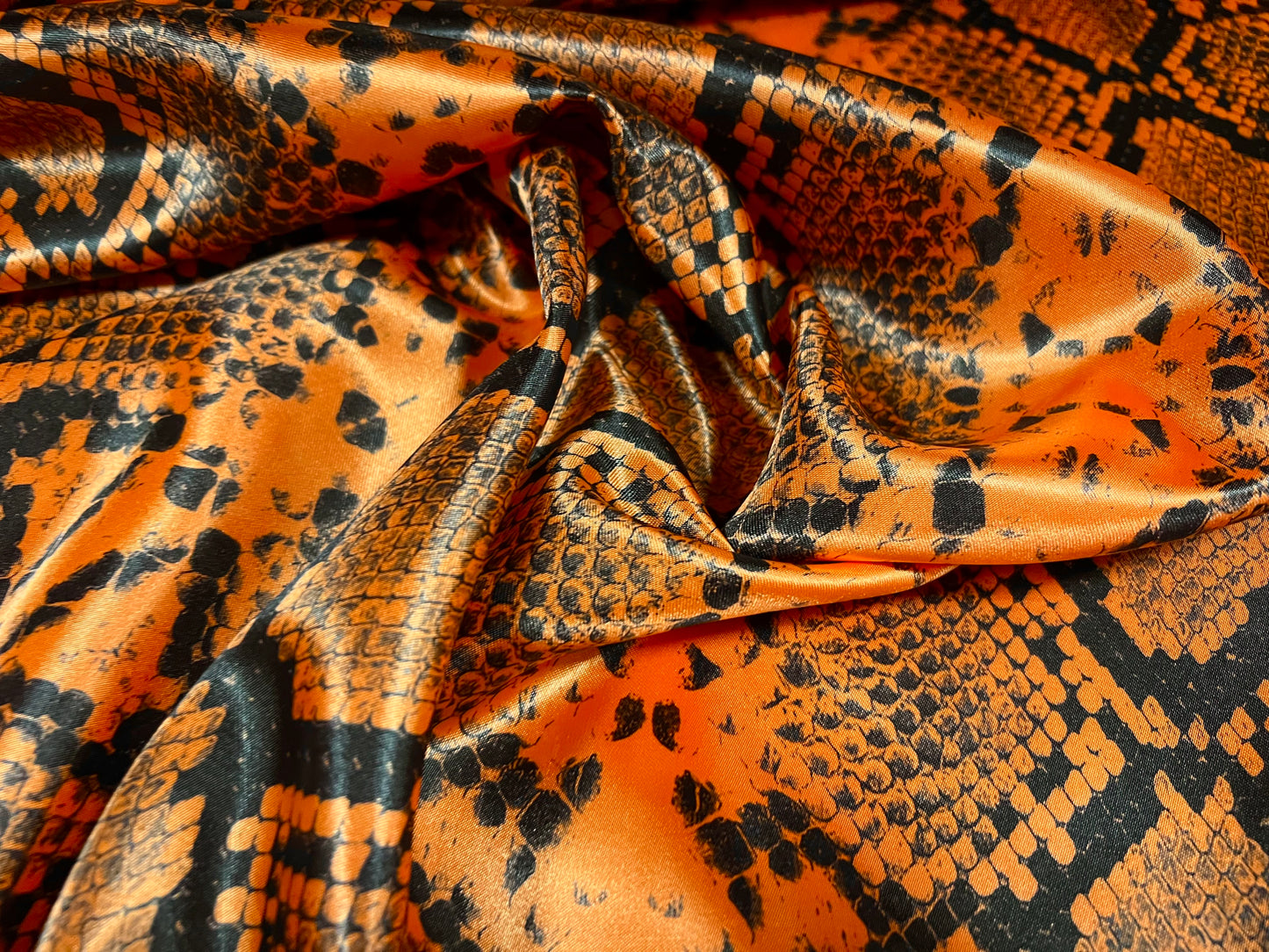 Silky Satin woven dress fabric, per metre - snakeskin animal print - orange