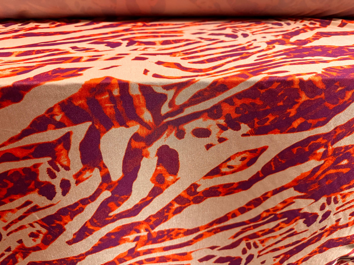 Yoga stretch spandex jersey fabric, per metre - stylised animal print - coral