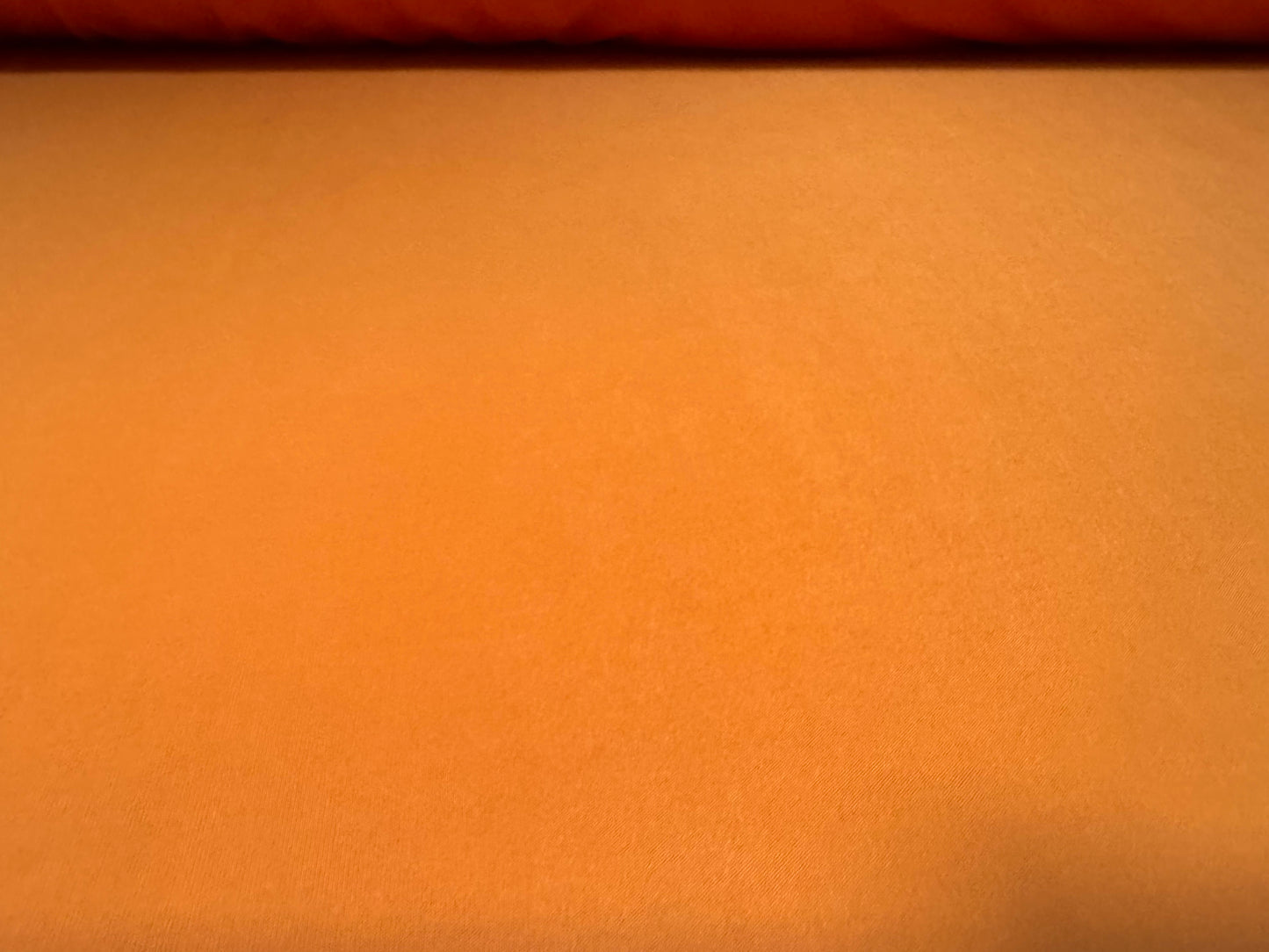 Soft touch spandex stretch jersey fabric, per metre - plain - pumpkin orange