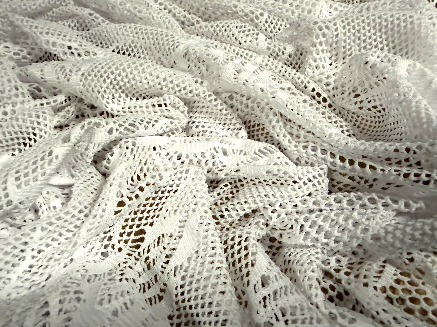 Stretch fishnet jersey fabric with floral design, per metre - white