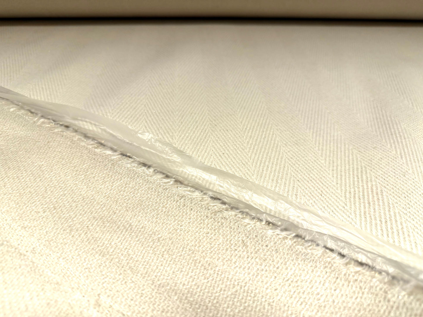 Plastic backed heavyweight wool fabric, per metre - herringbone - cream with silver lurex