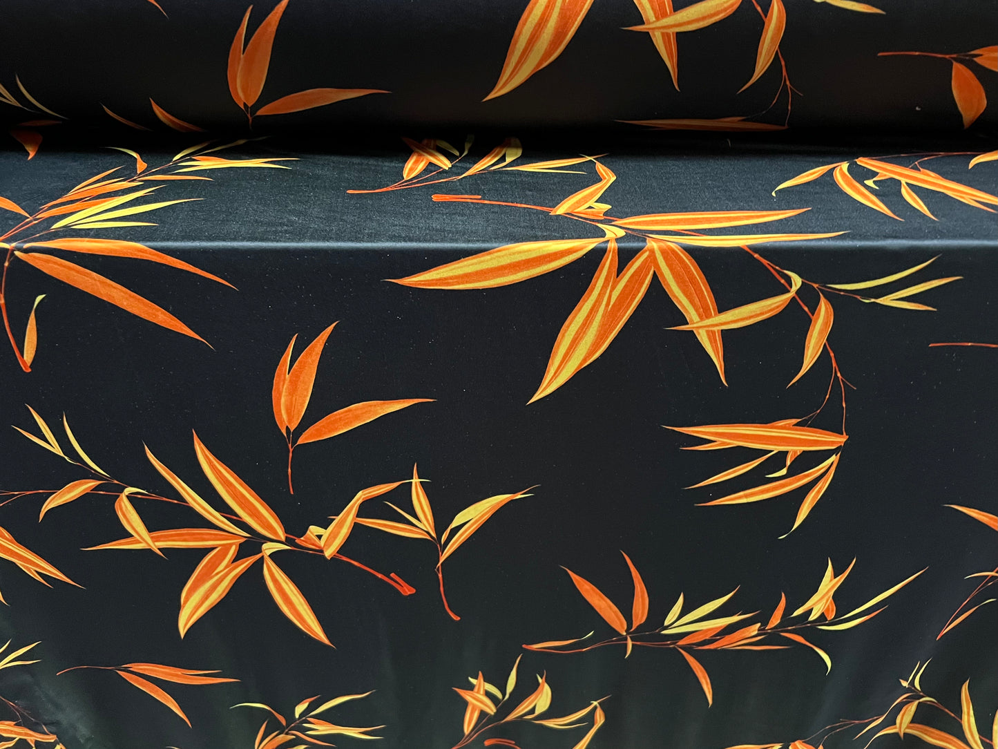Swimwear stretch spandex jersey fabric, per metre - leaf print - black & orange