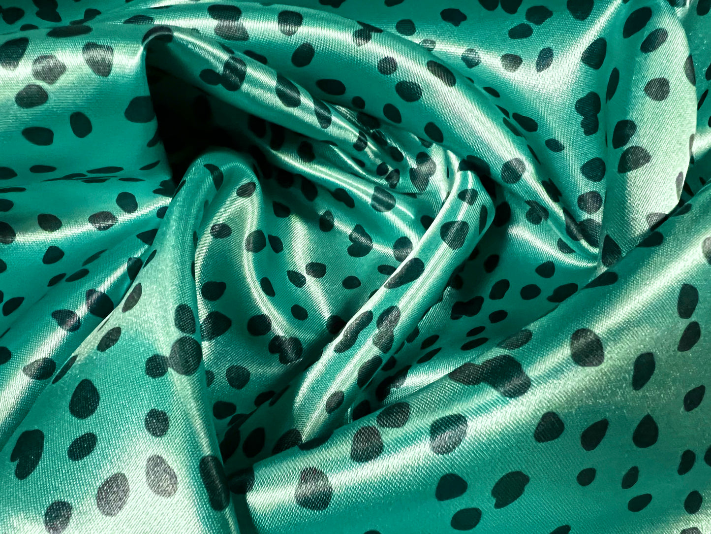 Silky Satin woven dress fabric, per metre - Dalmatian animal print - Turquoise & black