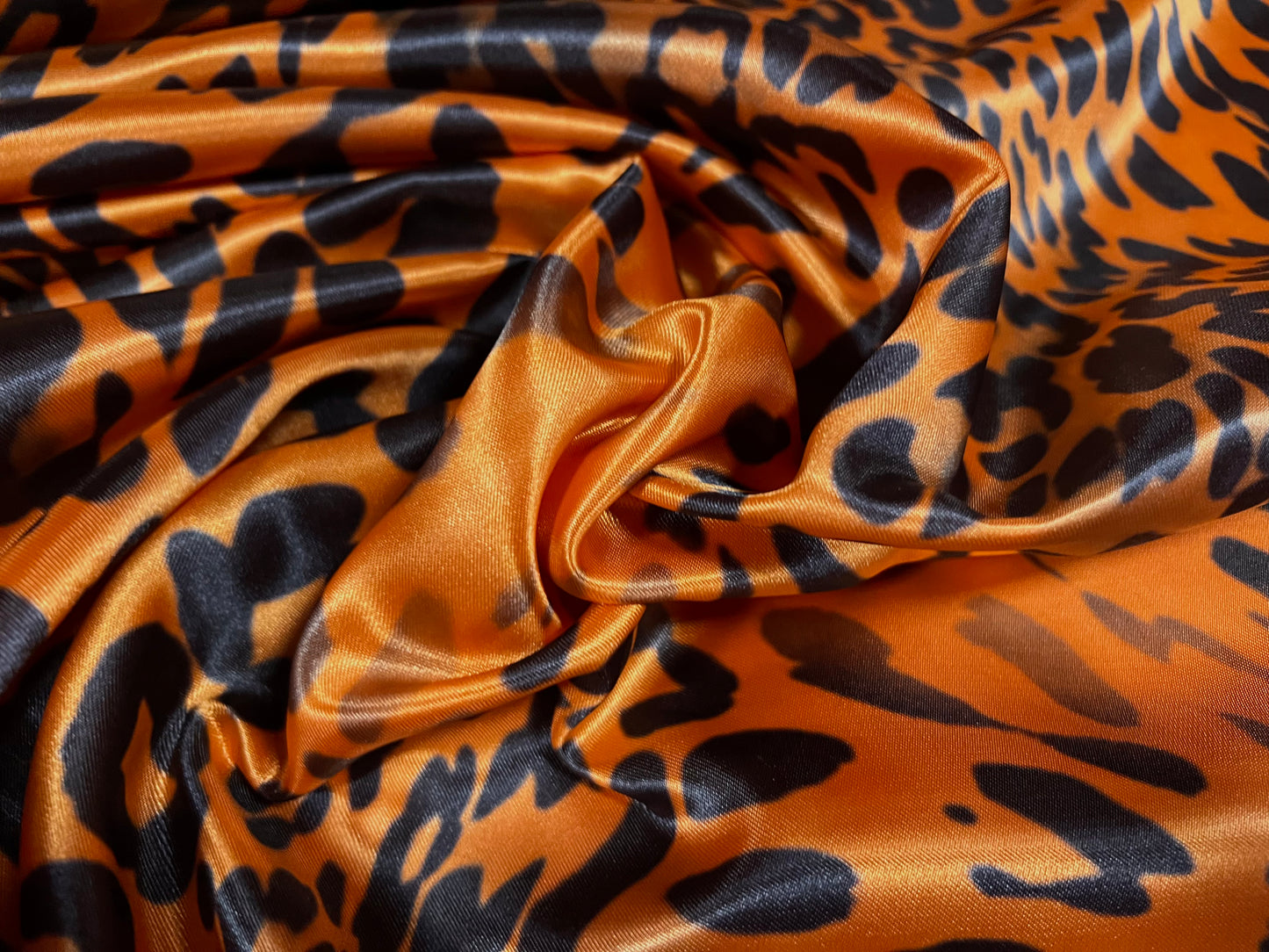 Silky Satin woven dress fabric, per metre - distressed leopardskin animal print - orange