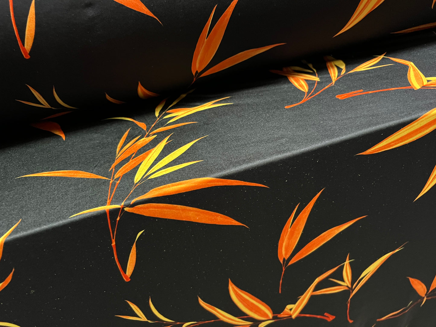Swimwear stretch spandex jersey fabric, per metre - leaf print - black & orange