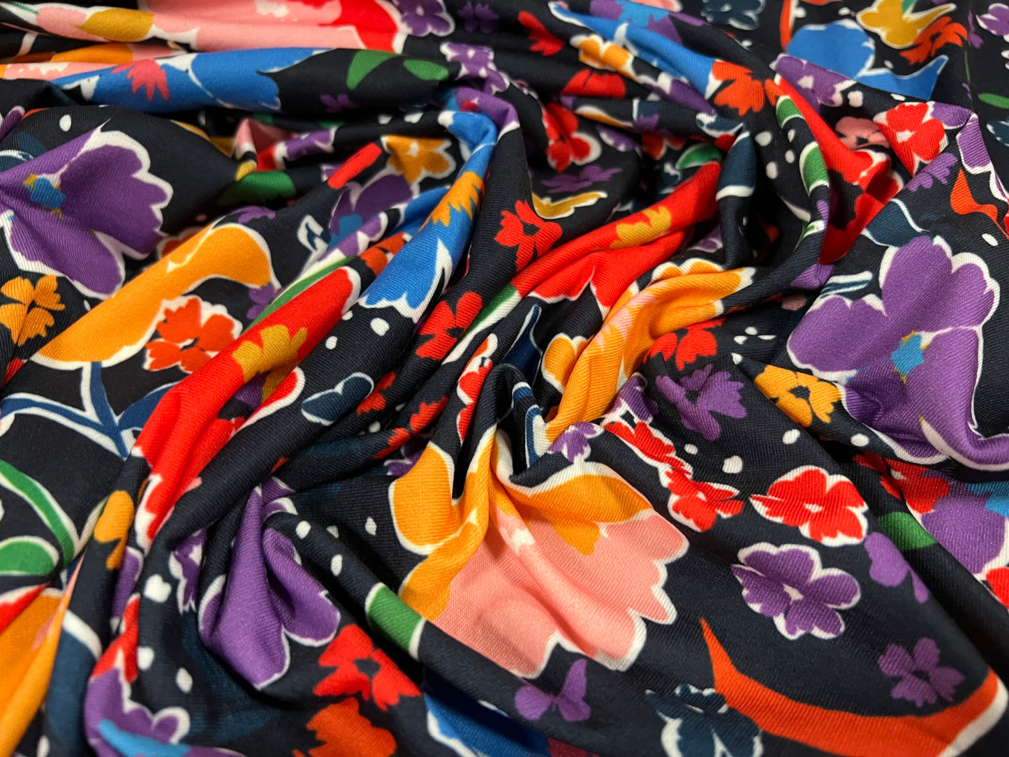 Soft handle stretch single jersey fabric, per metre - Night Garden print - black with multicolour flowers