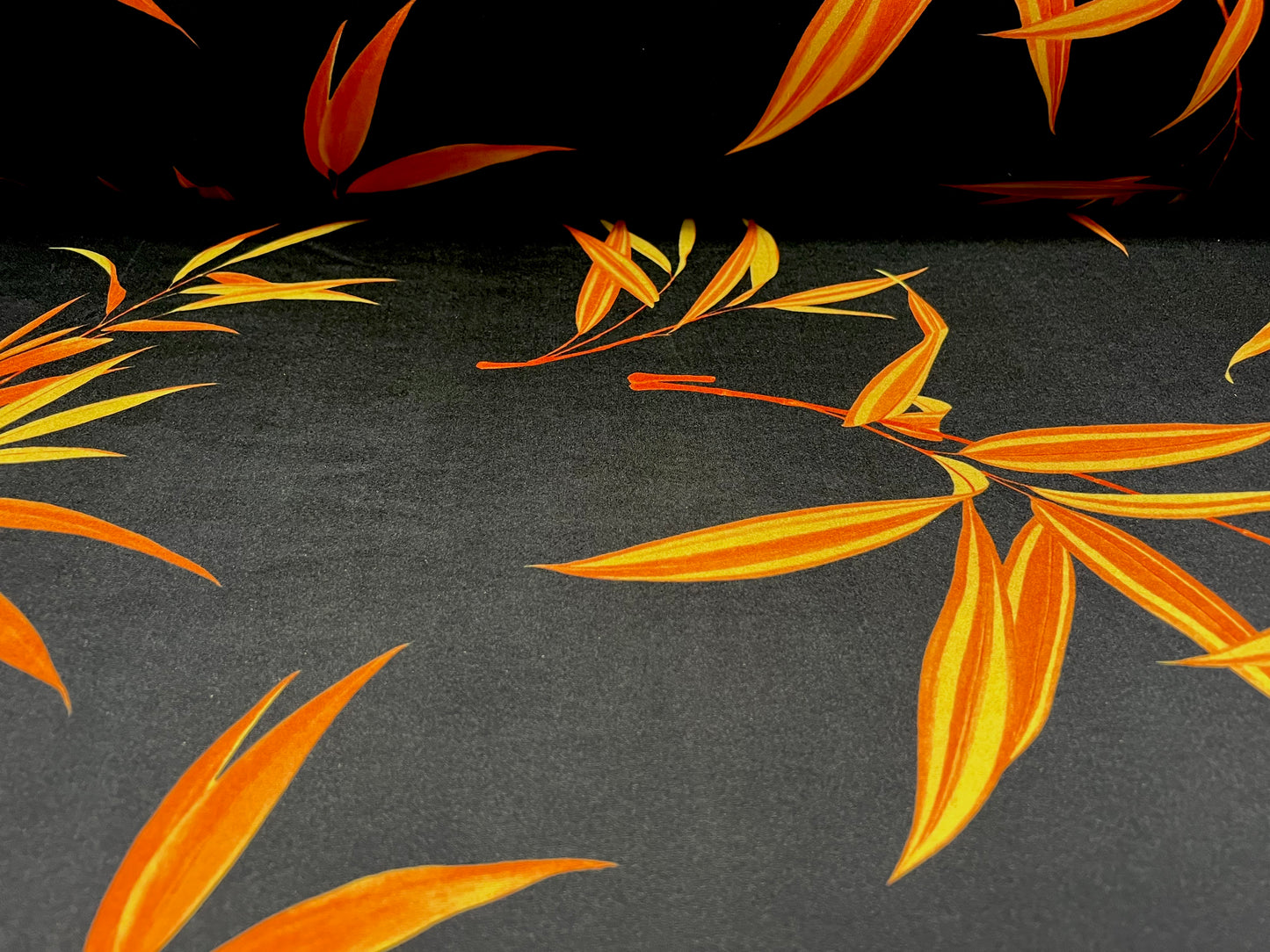 Swimwear stretch spandex jersey fabric, per metre - leaf print - black & orange