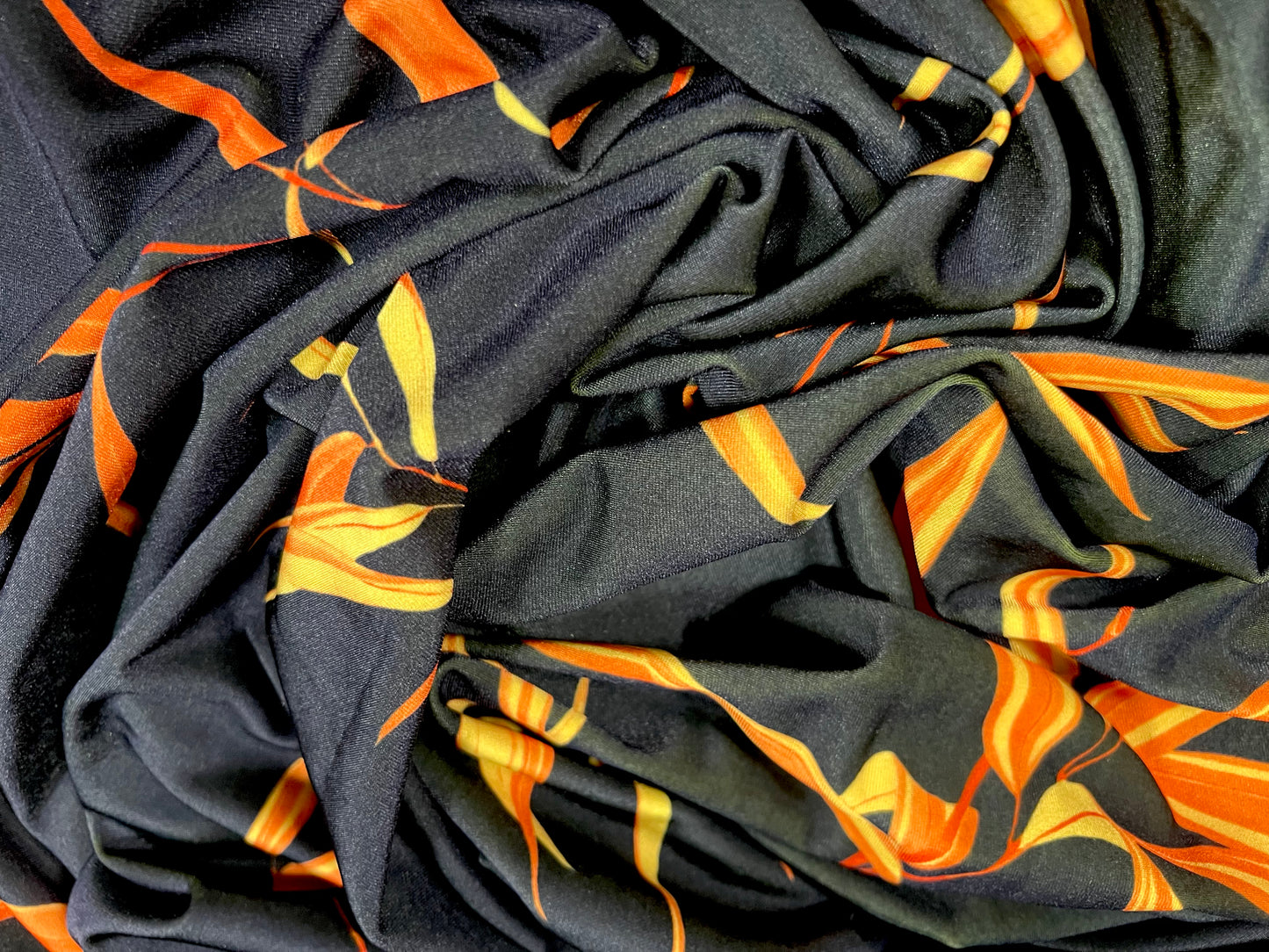Swimwear stretch spandex jersey fabric, per metre - leaf print - black & orange
