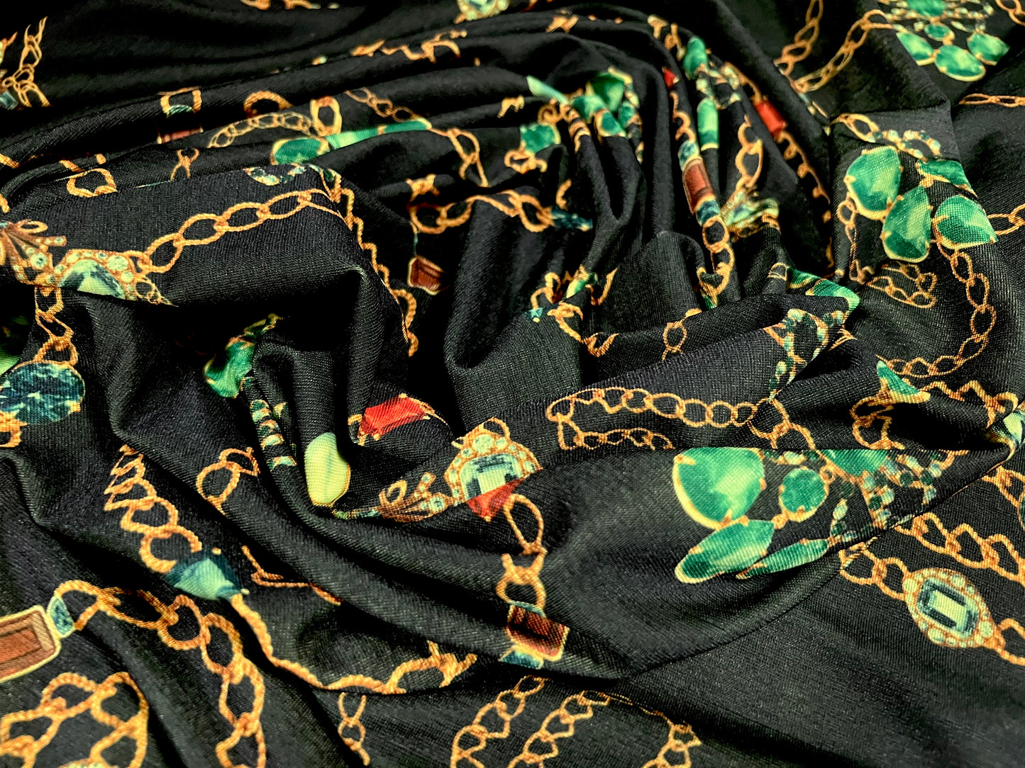 Finely textured stretch spandex single jersey fabric, per metre - jewels & chains print - black and emerald green